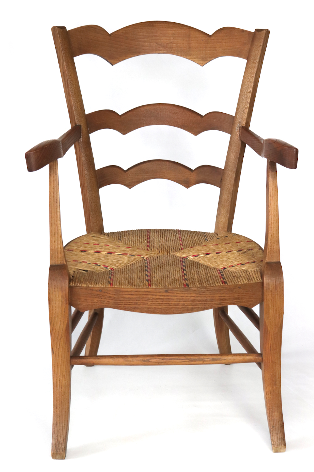 Antique wooden armchair with wickerwork