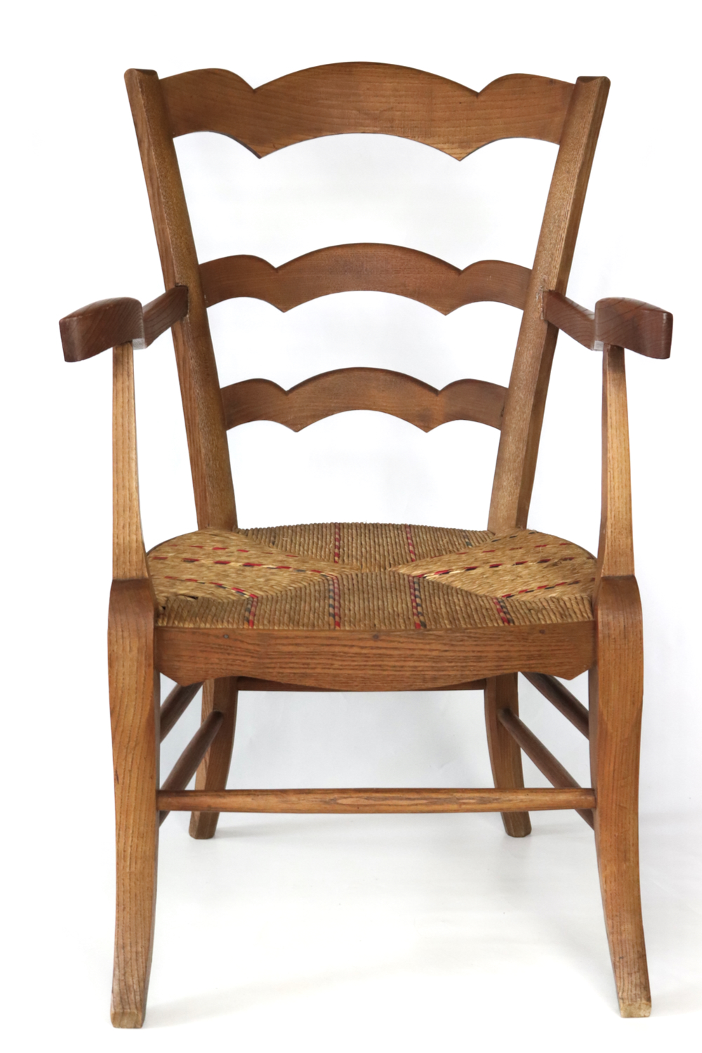 Antique wooden armchair with wickerwork