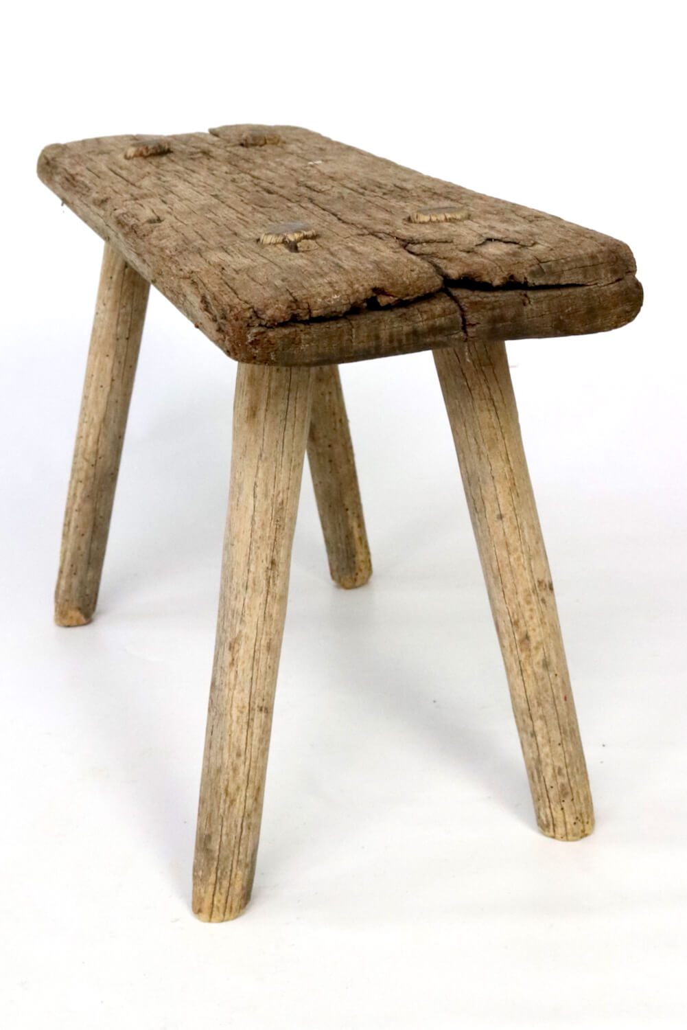 Old rustic farmers stool