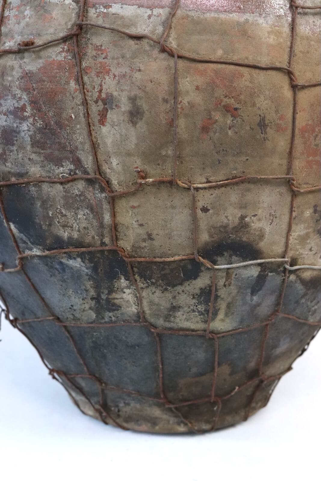 Antique terracotta pot with wire mesh Antique terracotta pot with wire mesh