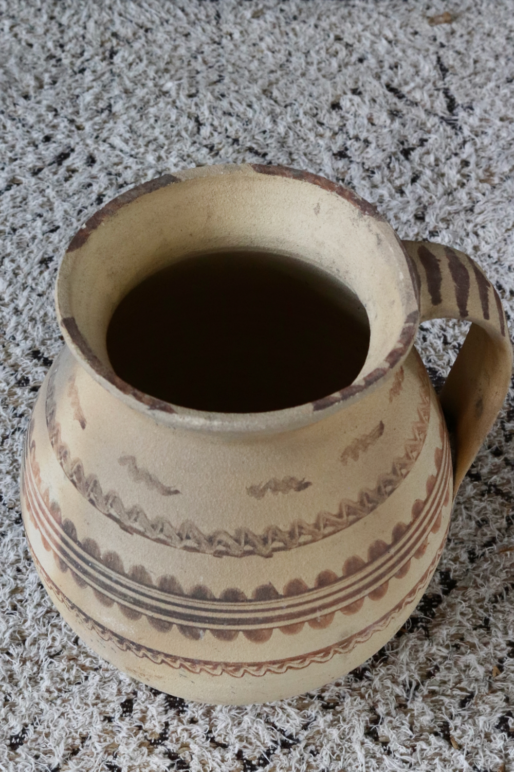 Antique terracotta jug