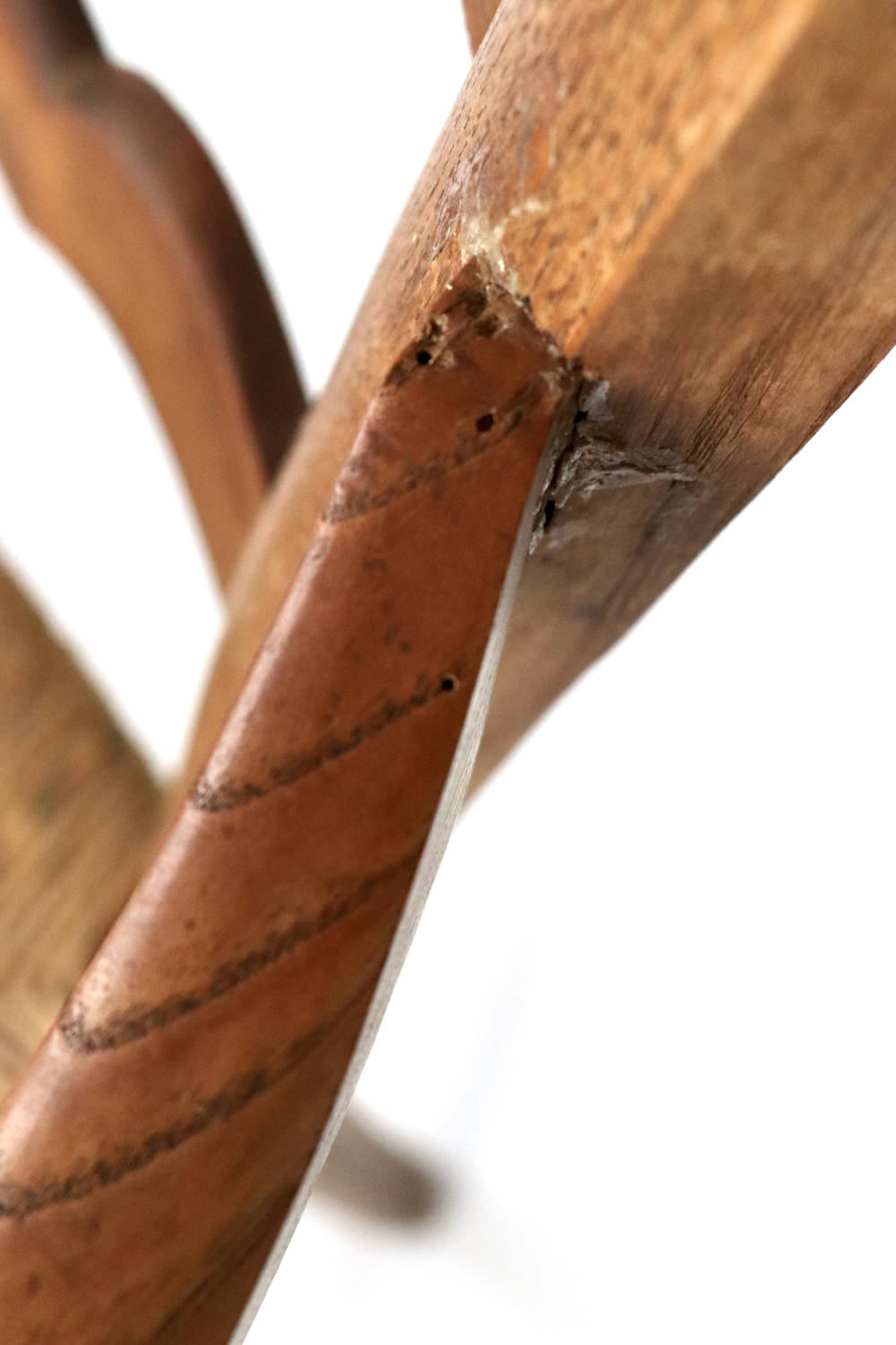 Antique wooden armchair with wickerwork