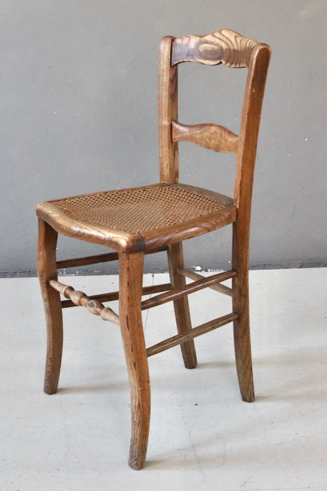 Antique wooden chair with wickerwork