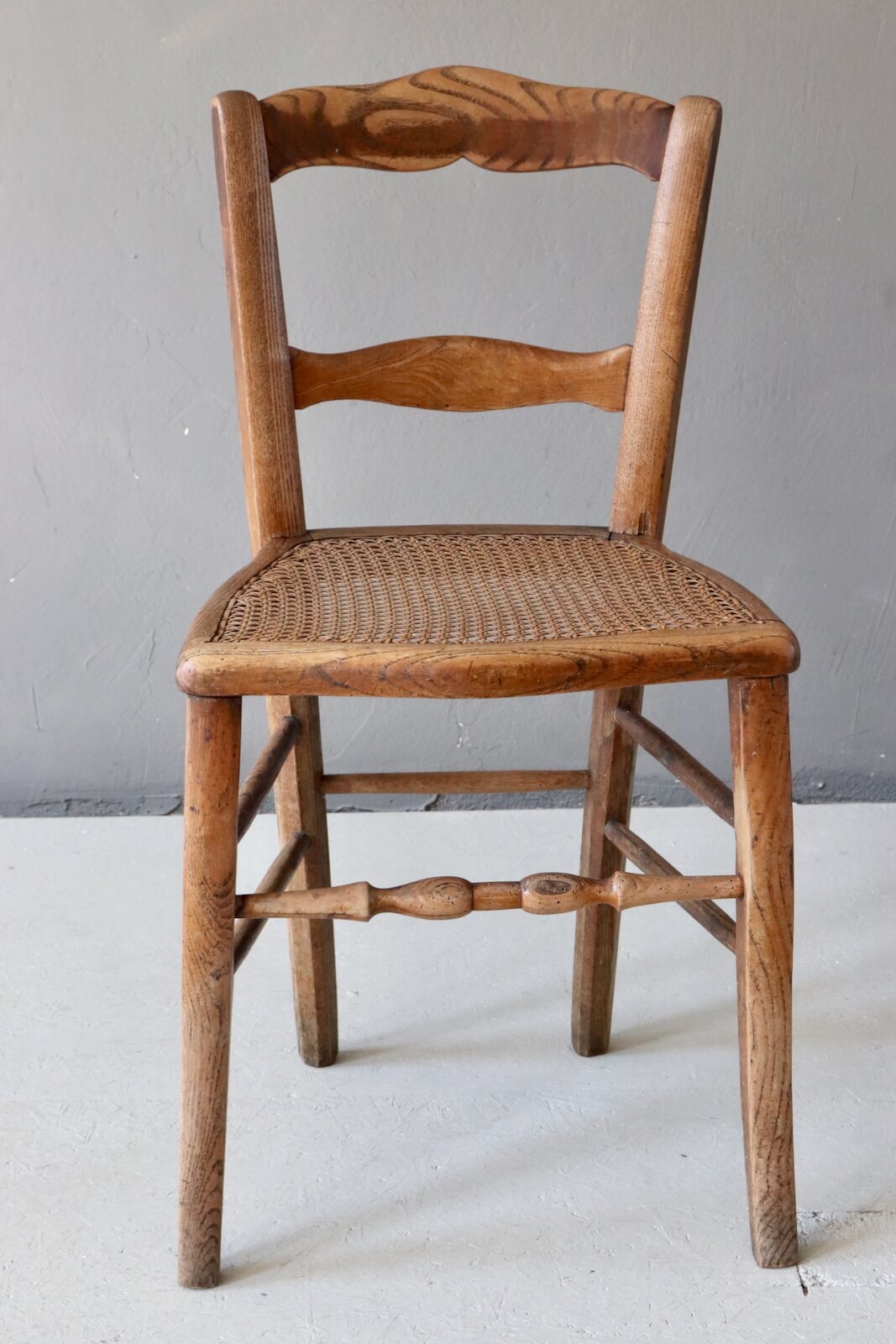 Antique wooden chair with wickerwork