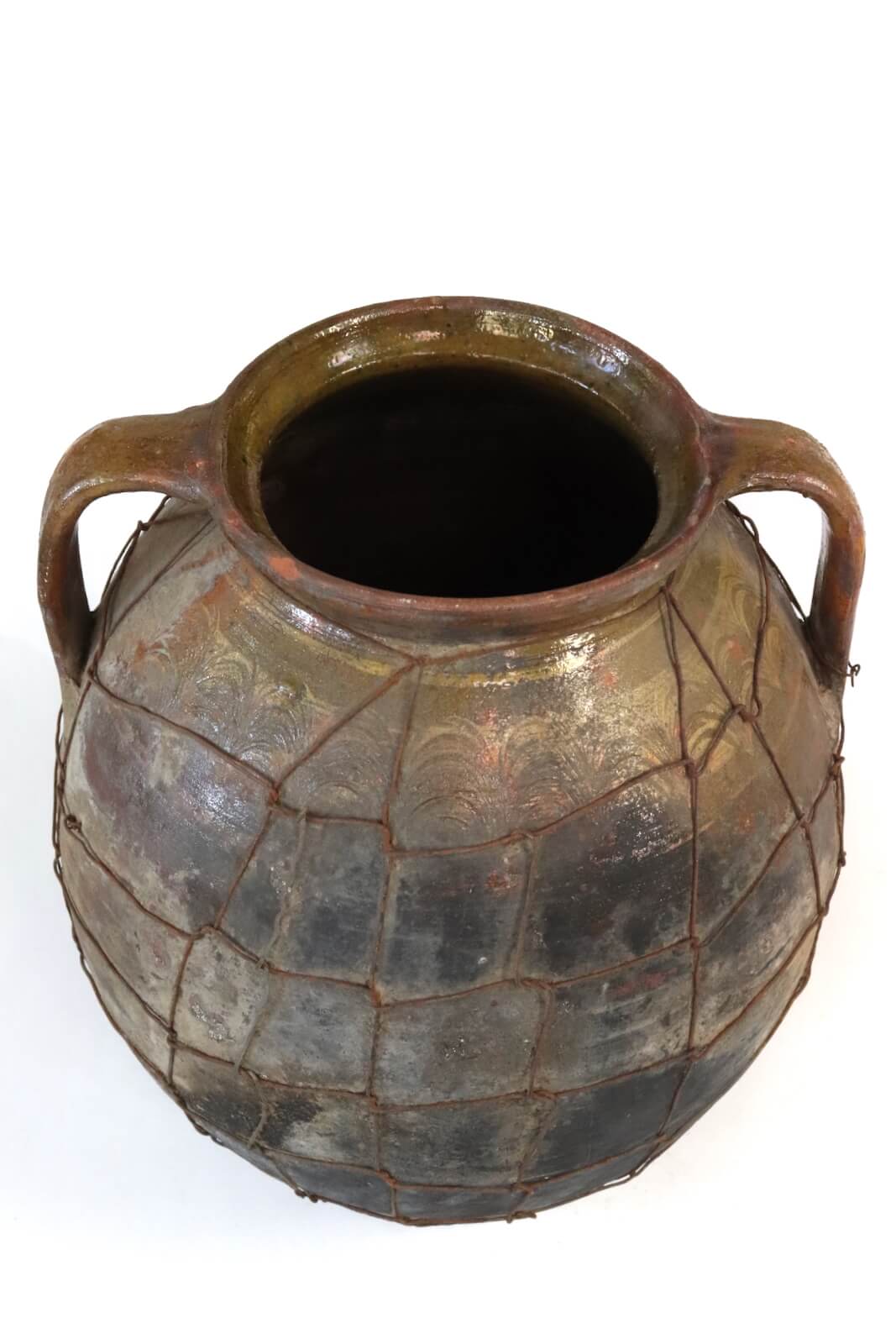 Antique terracotta pot with wire mesh Antique terracotta pot with wire mesh