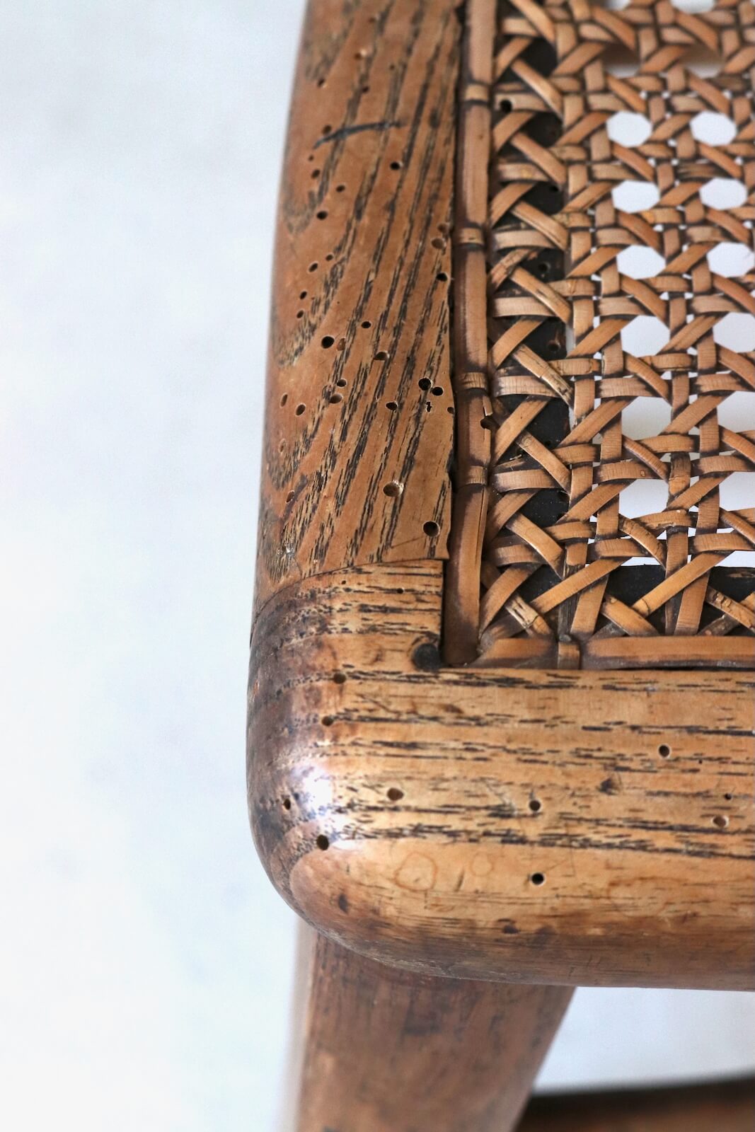 Antique wooden chair with wickerwork Antique wooden chair with wickerwork