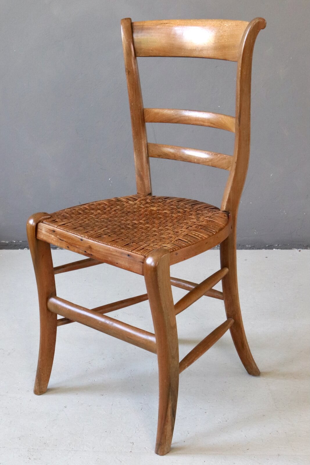 Antique wooden chair with wickerwork