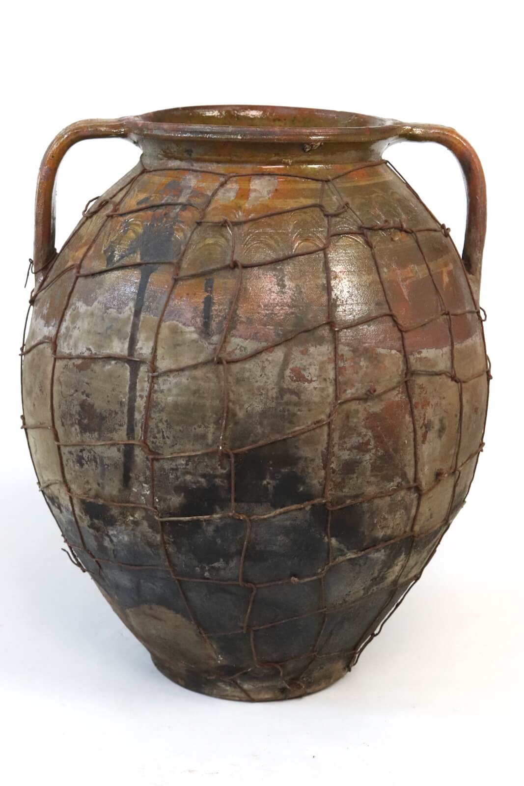 Antique terracotta pot with wire mesh Antique terracotta pot with wire mesh