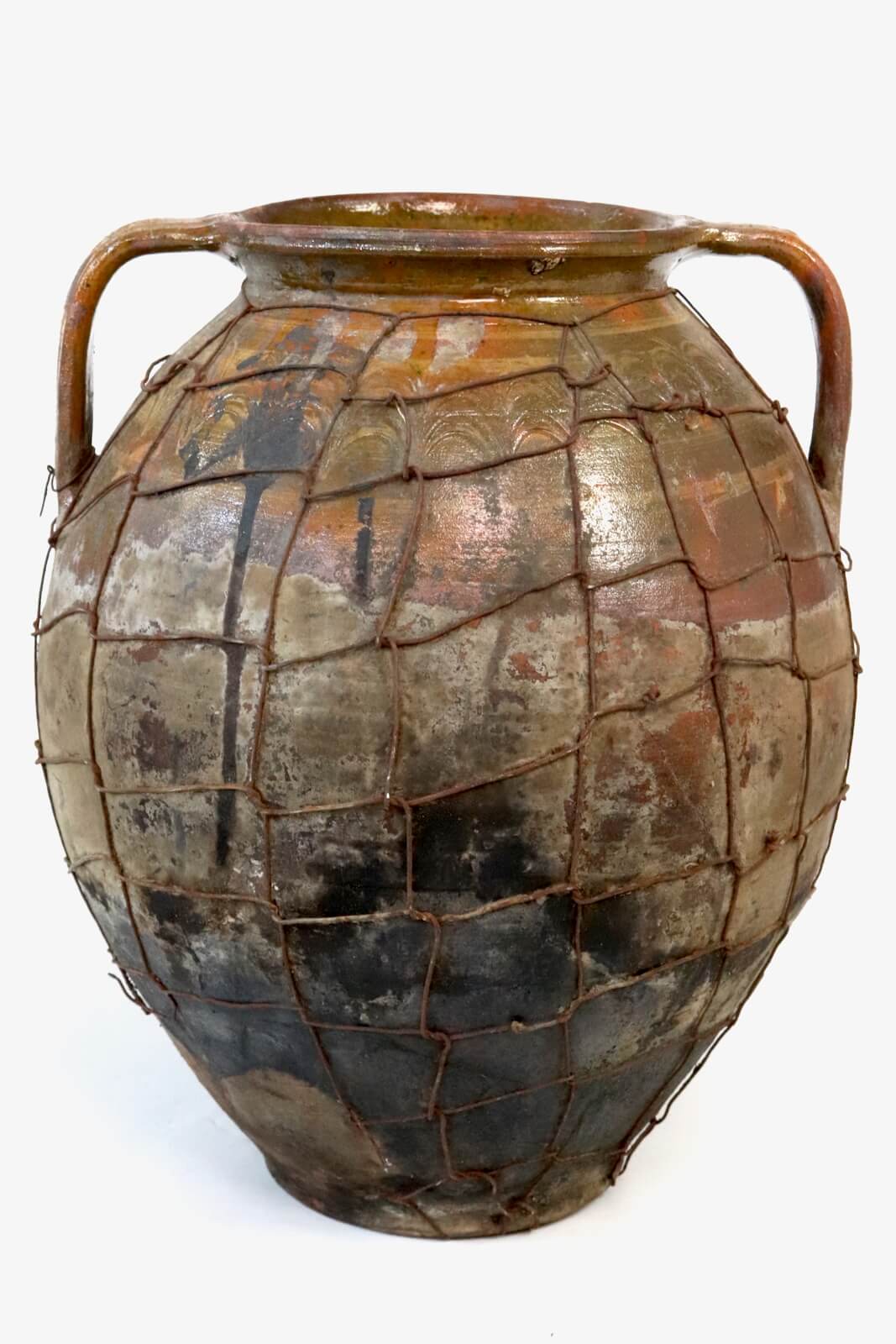 Antique terracotta pot with wire mesh Antique terracotta pot with wire mesh