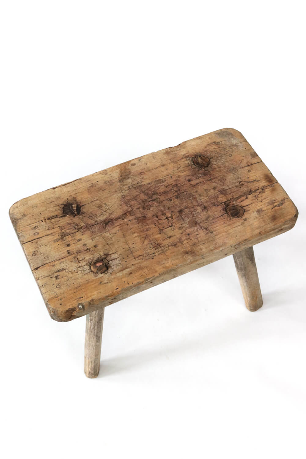 Old rustic farmers stool