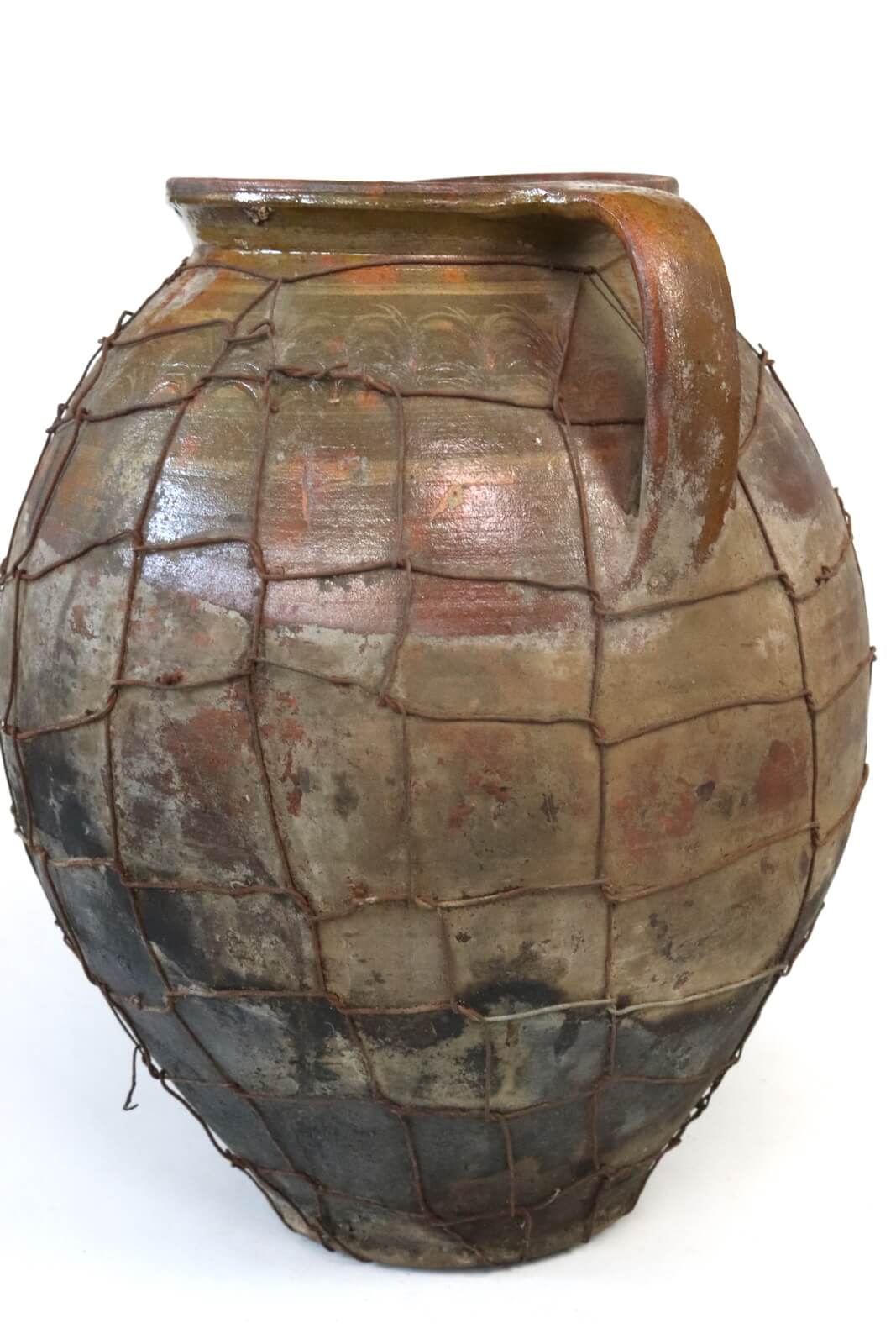 Antique terracotta pot with wire mesh Antique terracotta pot with wire mesh