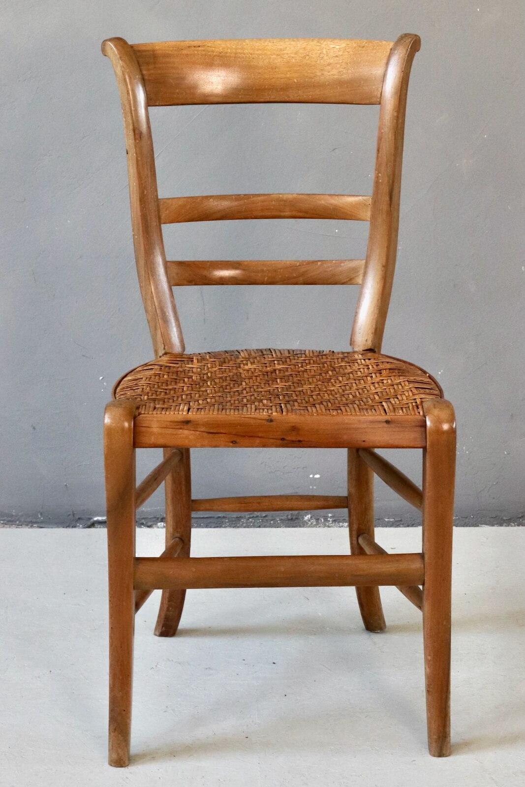 Antique wooden chair with wickerwork